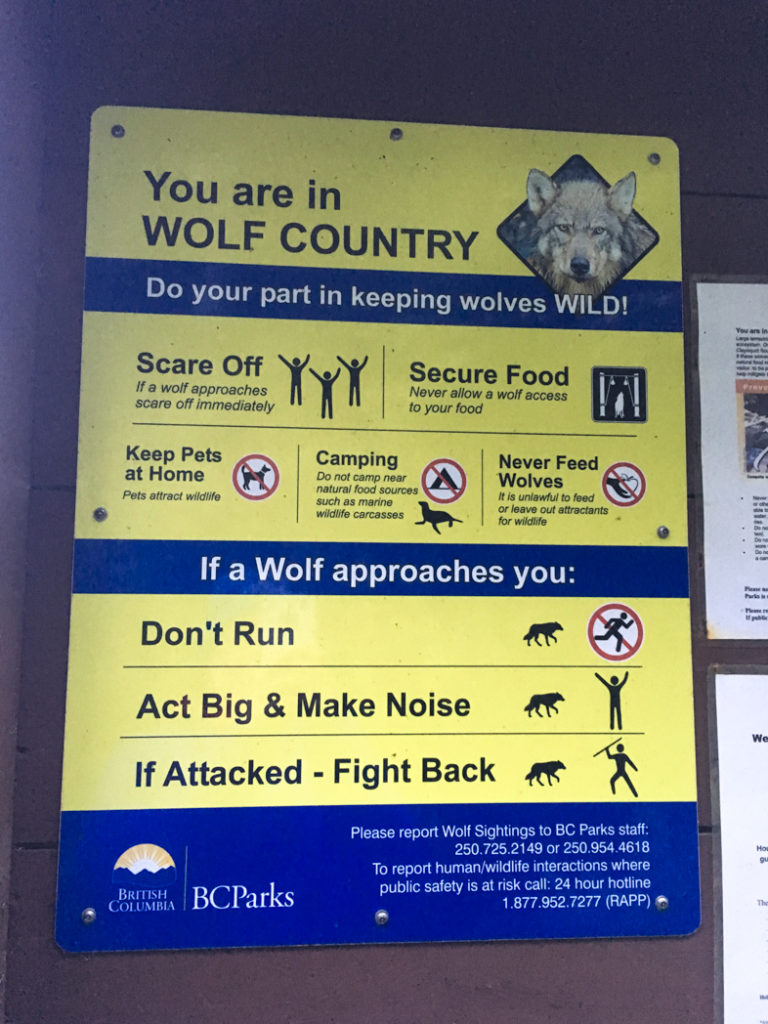 Sign warning about wolves on the Wild Side Trail near Tofino, BC