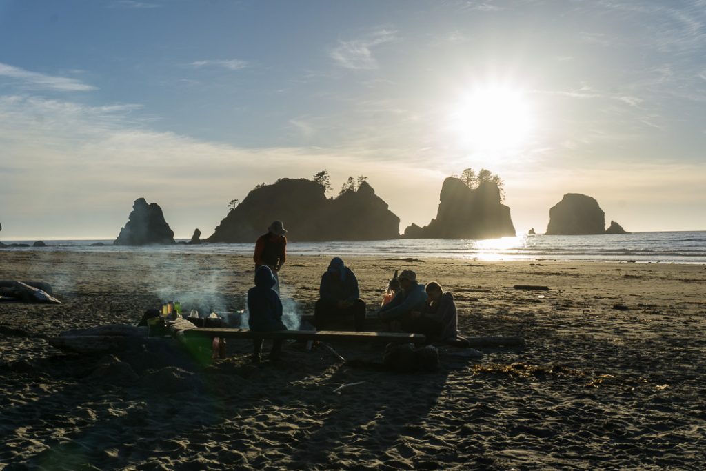 Enjoying our Nomad Nutrition meals on Shi Shi Beach. Nomad Nutrition dehydrated backpacking meals review. Gluten free and vegan dehydrated backpacking meals - just add boiling water.