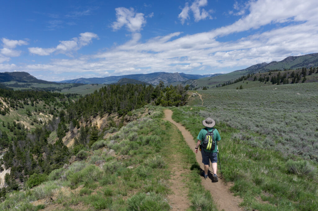 A hiker in Yellowstone National Park. Best hikes in Yellowstone National Park