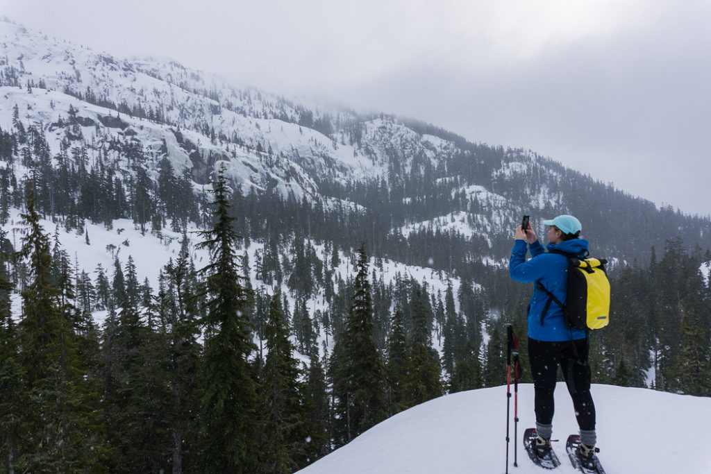 A woman snowshoeing in Squamish BC.