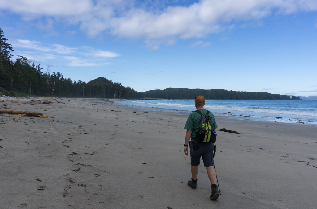 A hiker walks on Bowen Beach, Cape Scott Provincial Park