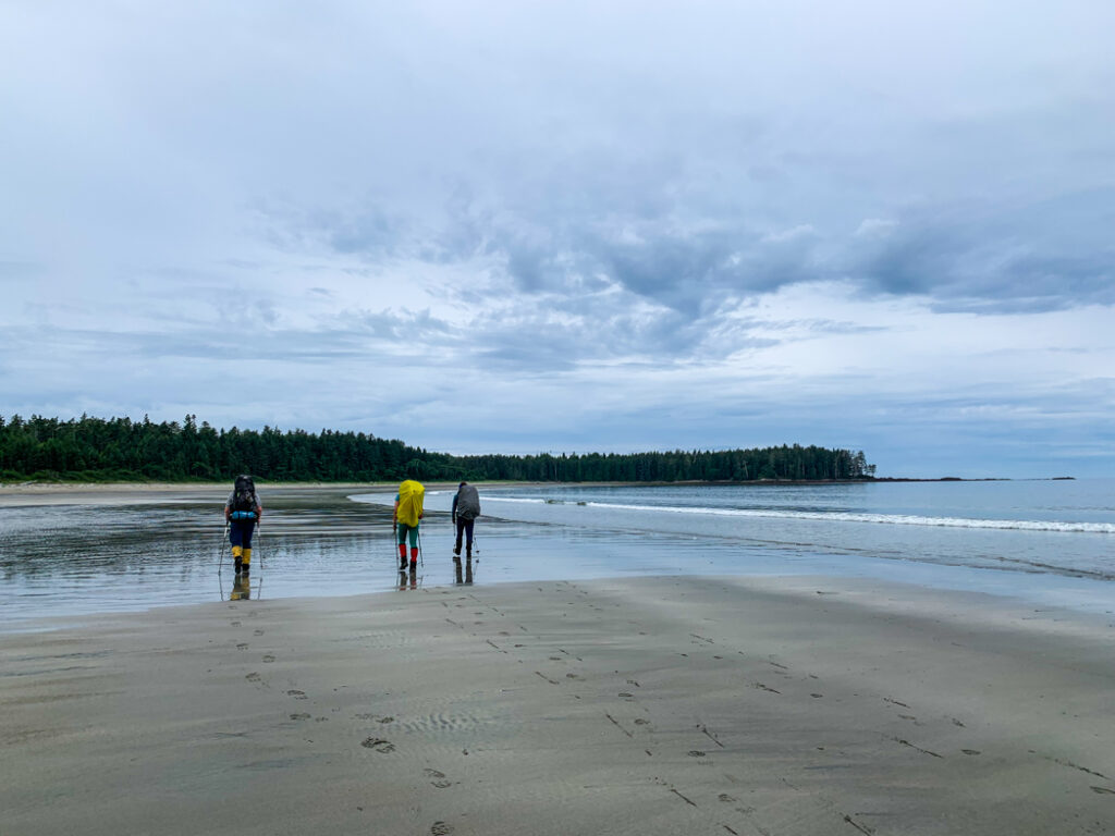 Hikers leaving Shuttleworth Bight on the North Coast Trail
