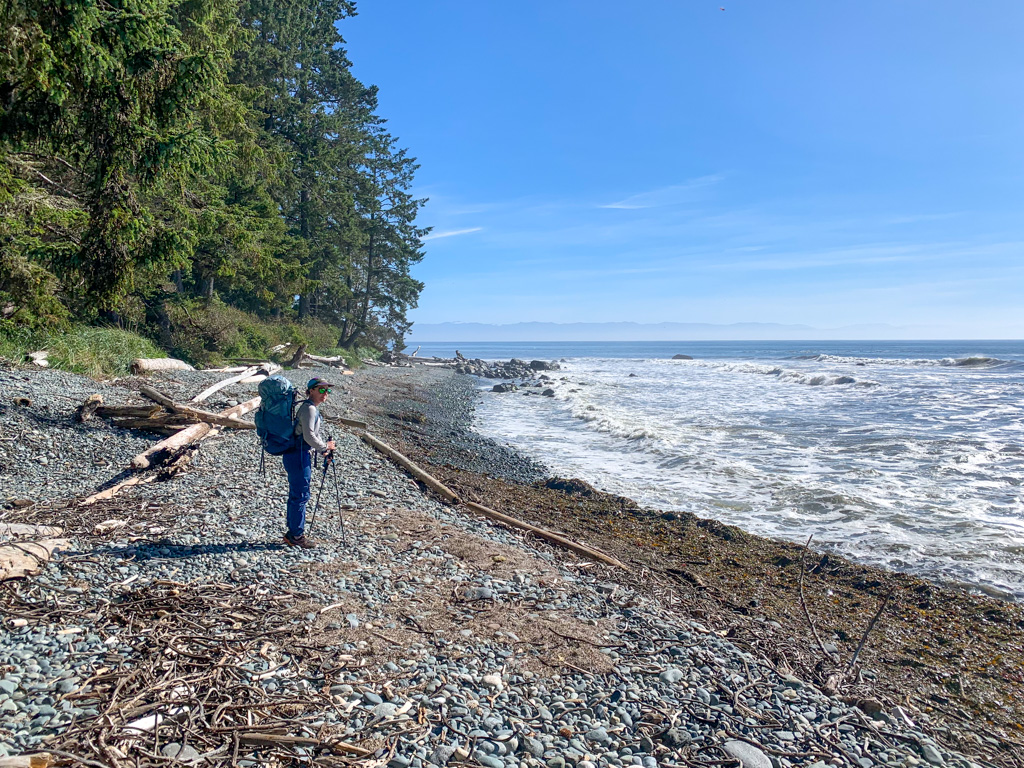 A backpacker on Bear Beach on the Juan de Fuca Trail on Vancouver Island