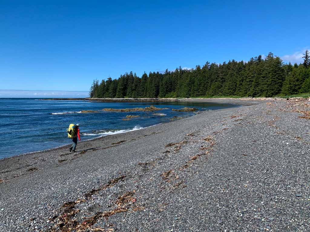 Hiking a gravel beach on the Tatchu Peninsula
