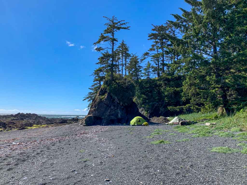 Camping next to a sea stack