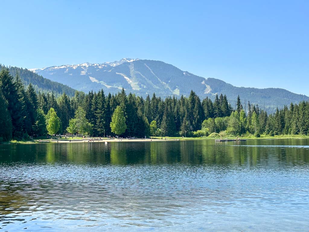 The beach at Lost Lake with mountains behind.