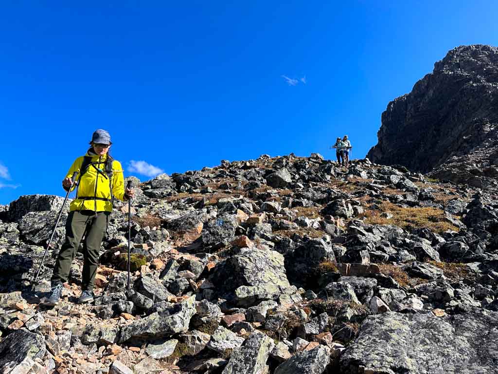 A group of hikers descend from All Soul's Prospect