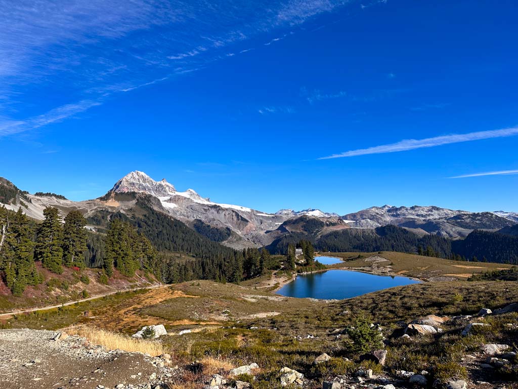 Elfin Lakes seen from the south with Mount Garibaldi/Nch'Kay, Opal Cone, and glaciers in the background. Elfin Lakes is one of the best hikes in Squamish.