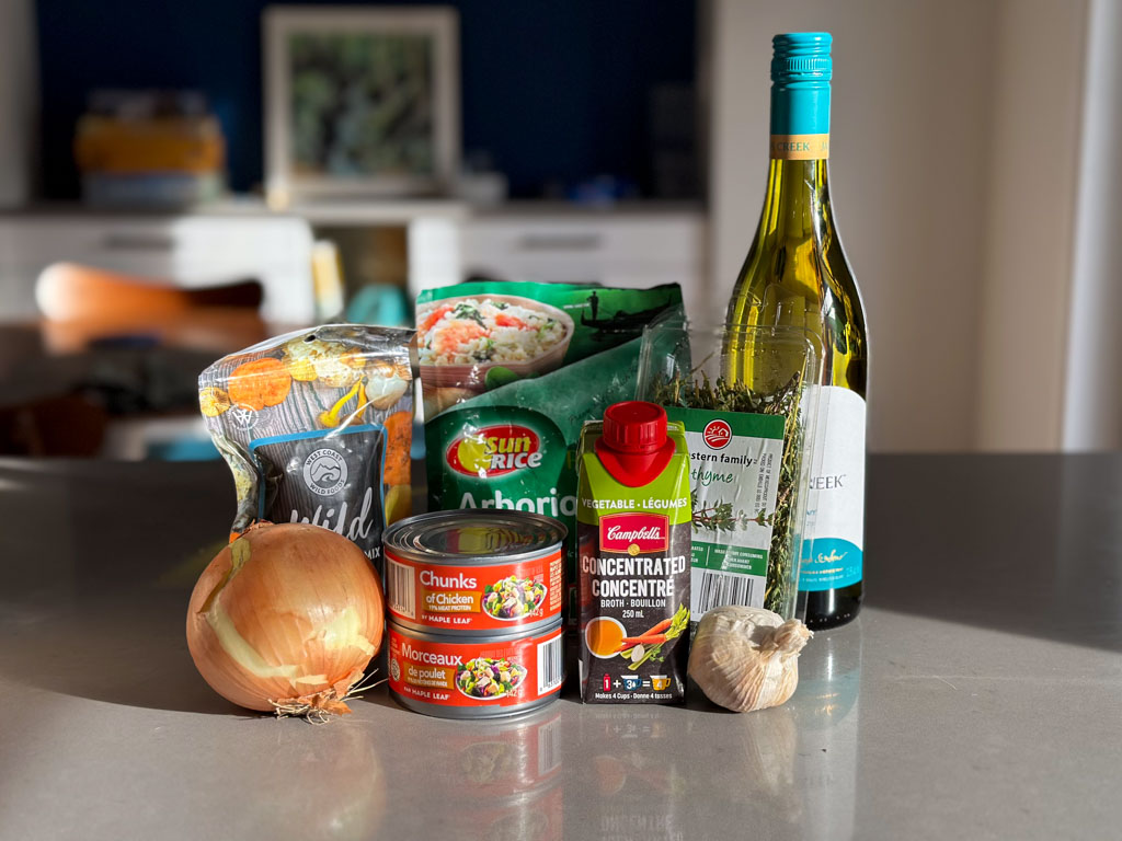 Ingredients for making dehydrated mushroom risotto are grouped together on a kitchen counter. 