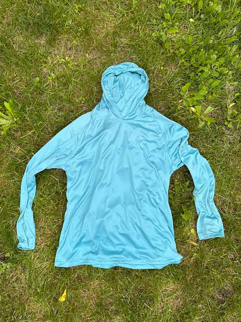 The Willit sun hoodie from Amazon laid flat on grass