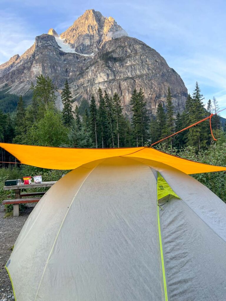 Tent under a tarp at Kicking Horse Campground in Yoho National Park.