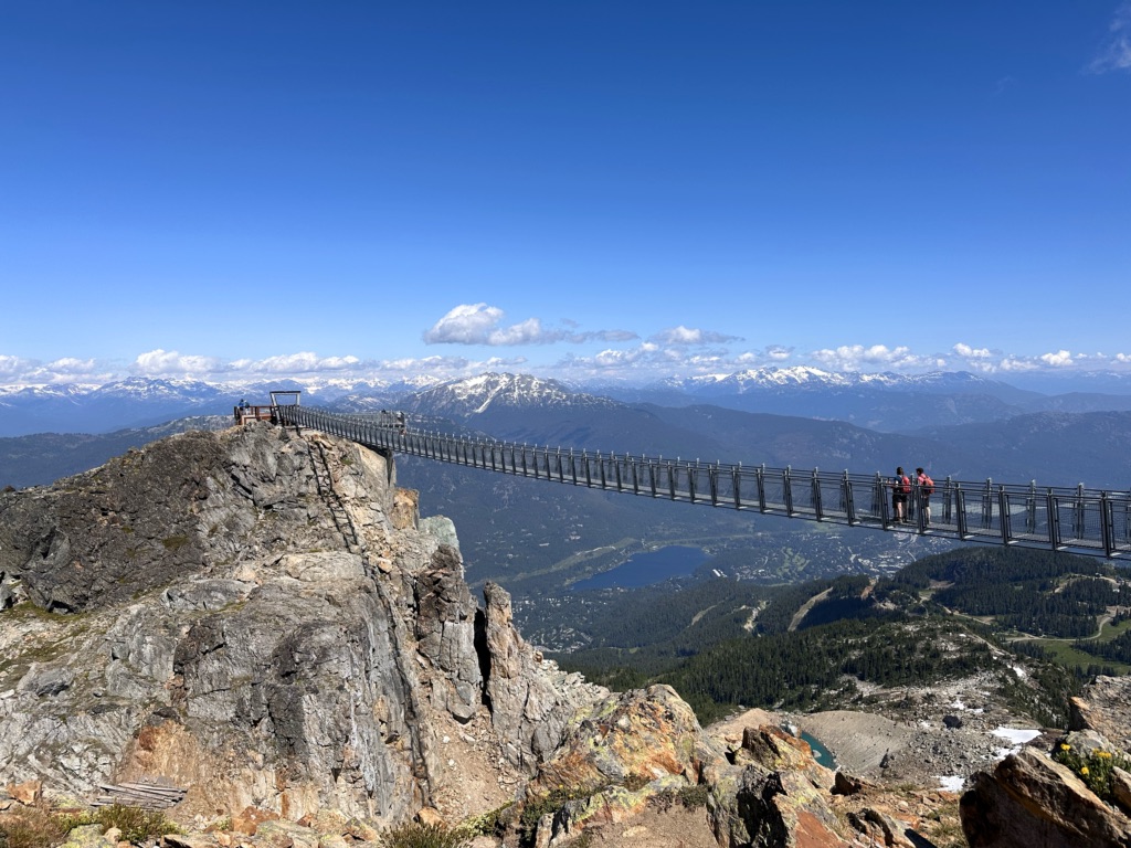 People walk across the Cloudraker Suspension Bridge at Whistler