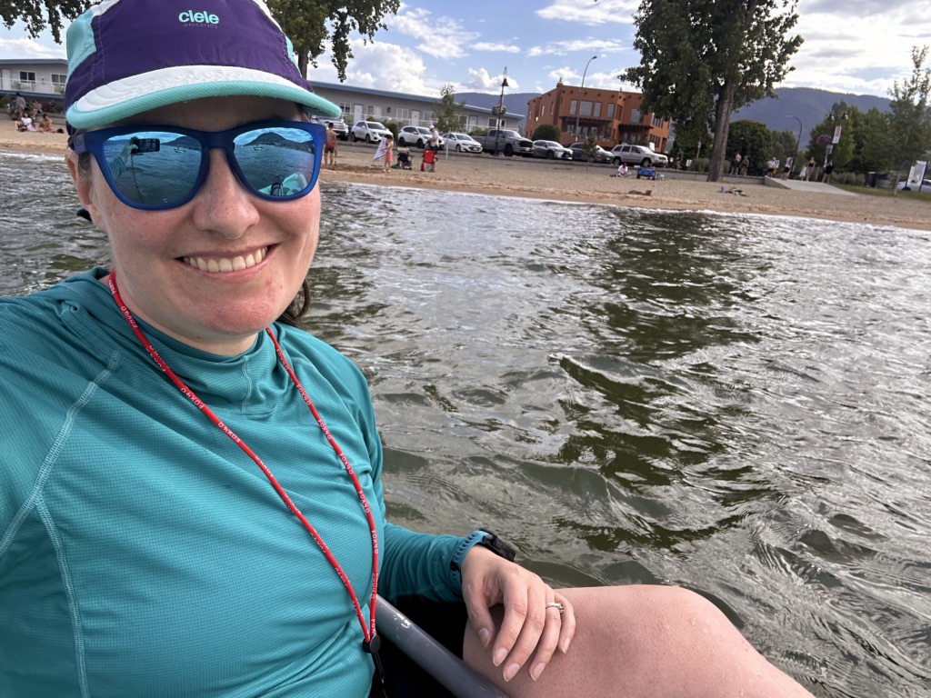 A woman takes a selfie in a kayak