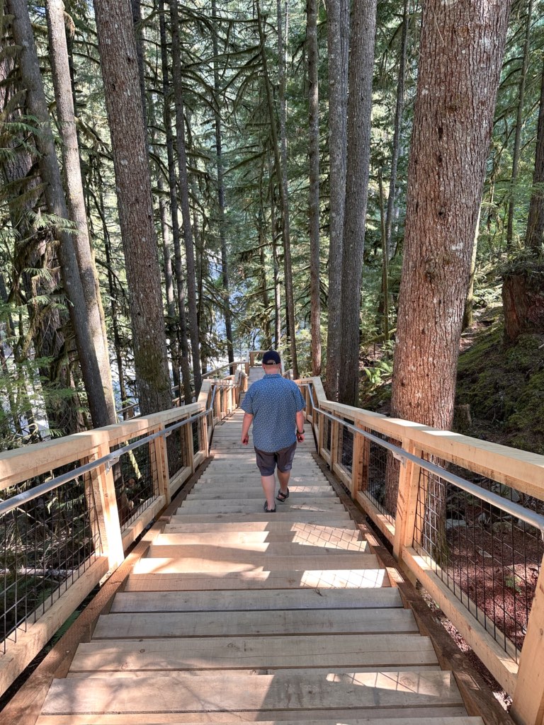 A man walks down the stairs at Squamish Canyon