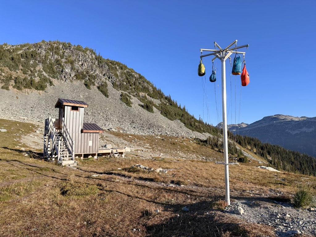 Toilet and food hanging poles at the Russet Lake Campground near Whistler