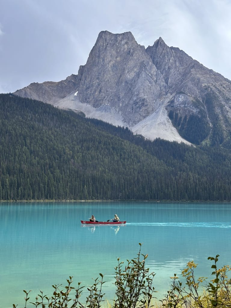 People in a canoe on Emerald Lake in Yoho National Park