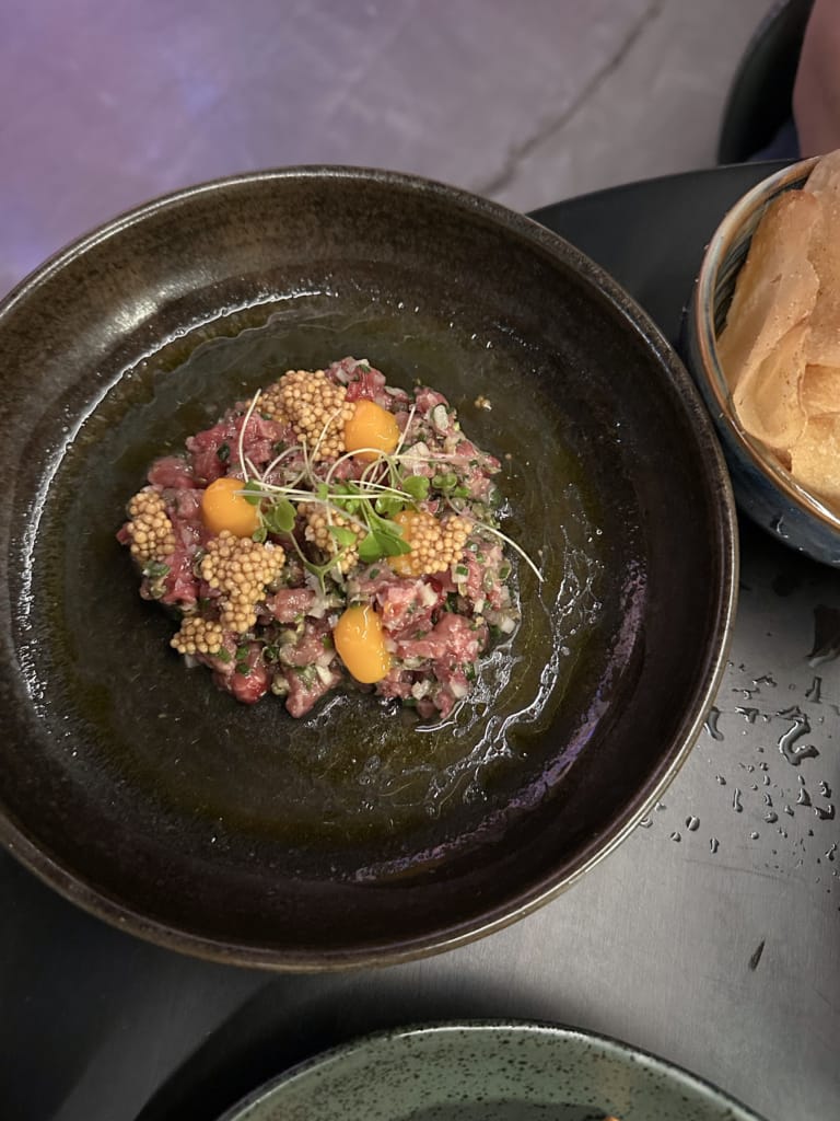 A plate of beef tartare at Stolen Bell Distillery in Golden, BC