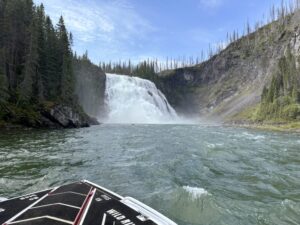 A jet boat approaches Kinuseo Falls, one of the best things to do in Tumbler Ridge