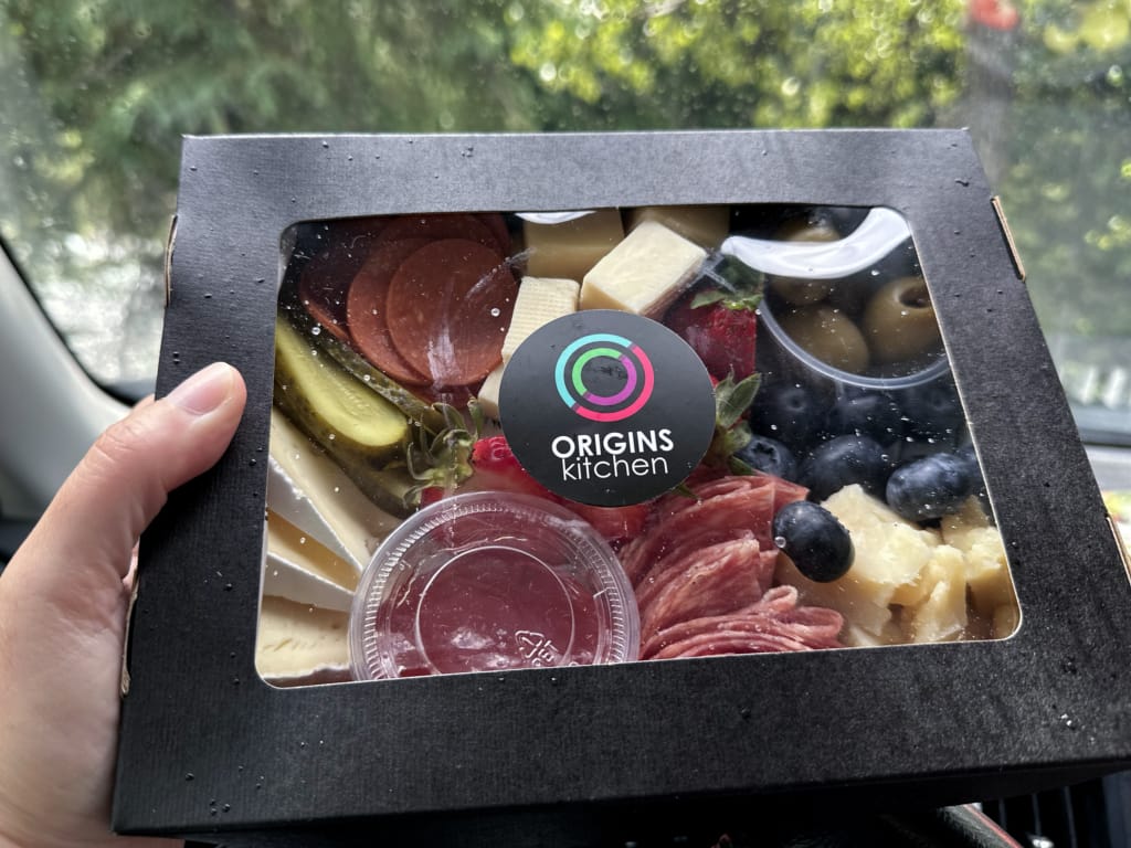 A to-go charcuterie box from Origins Kitchen